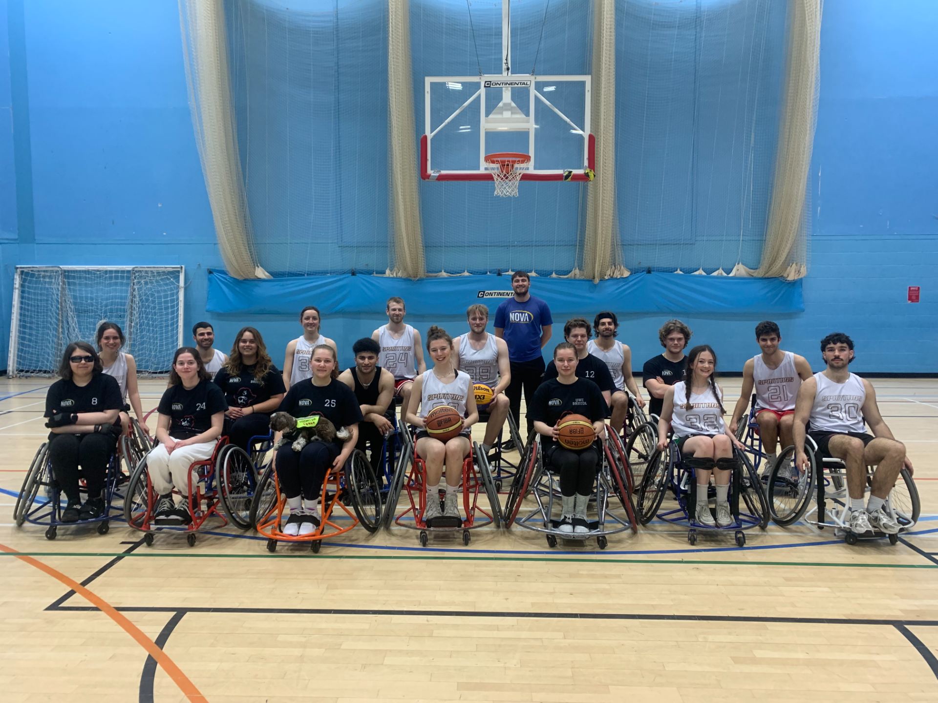 The wheelchair basketball team posed for a photo